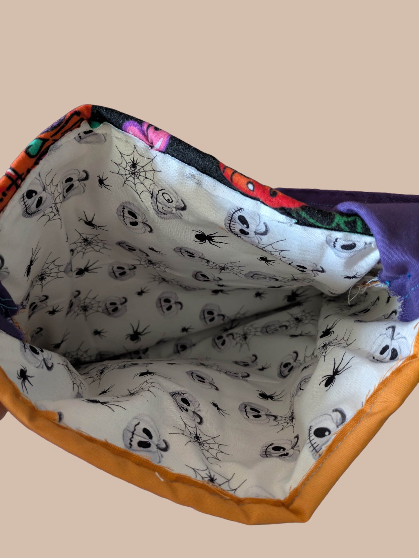 Handmade fabric pouch with Halloween-themed design 
